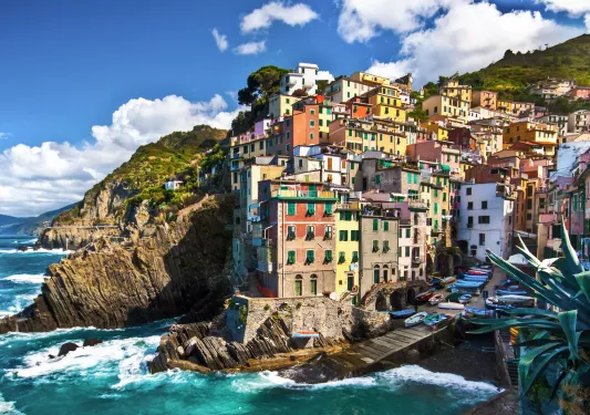 Cliffside by the ocean with buildings on top