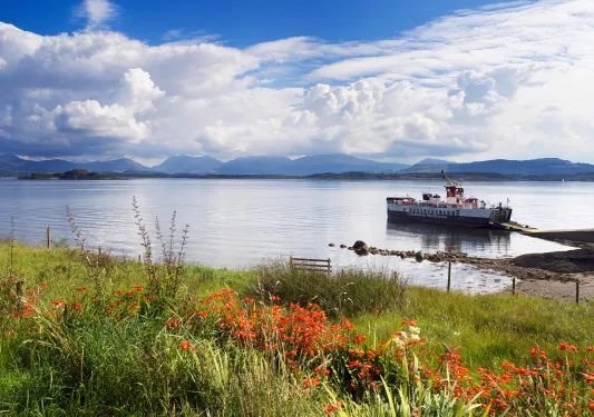 Large lake with a boat docked by the shore