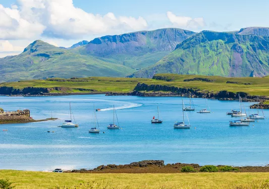 Multiple boats floating in a large lake