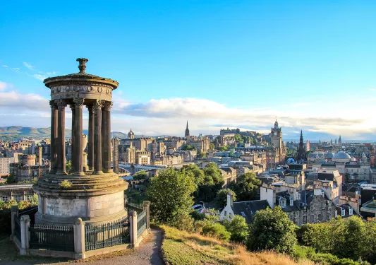 Stone statue overlooking a rustic town
