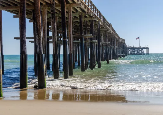 Under-bridge view of an ocean shore