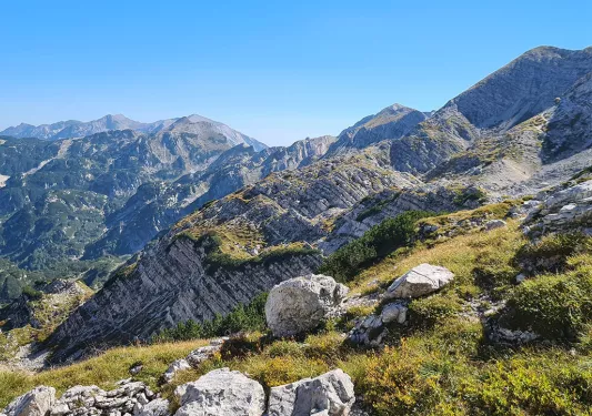 Hill full of grass and large boulders