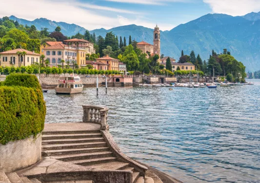Ocean with a town and boats docked by the shore