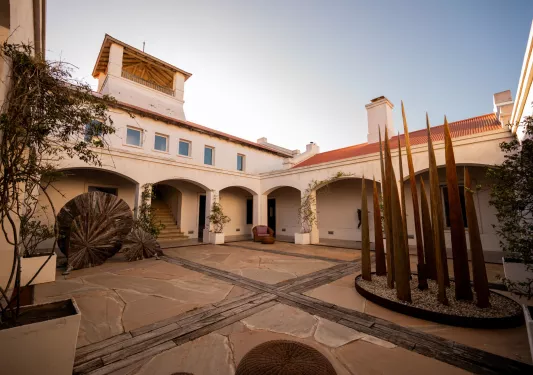 Outdoor courtyard with a large building in the back