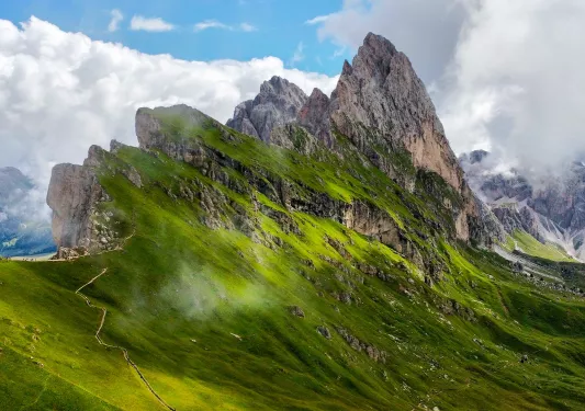 Steep mountain peaks covered in grass