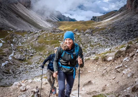 Two backroads guests hike up a mountain