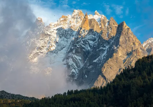 Snowy mountain covered in fog