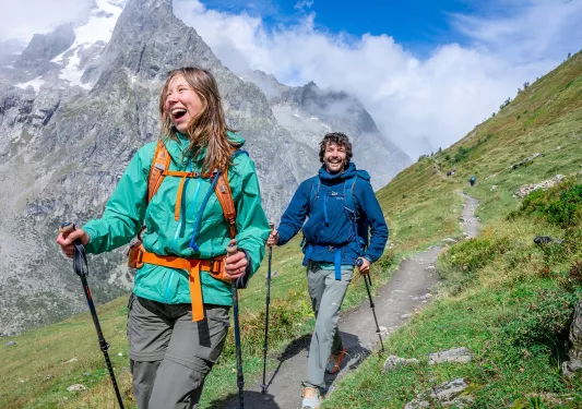 Two backroads guests hike up a mountain