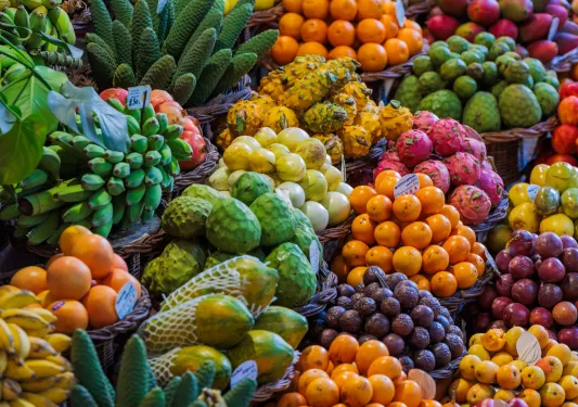 Bundles of colorful fruit at a vendor's stall