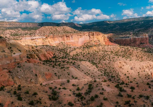 Large valley of hills and orange canyons