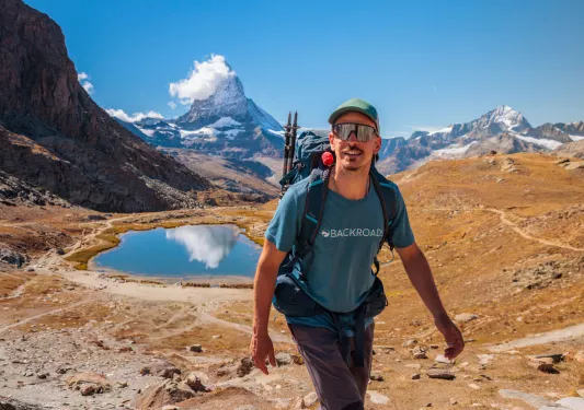 Backroads guest on hike with lake in background