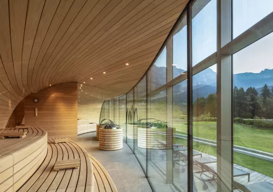 Sauna with large windows looking out to a large field