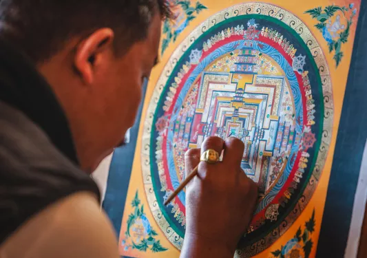 Man painting on a colorful canvas