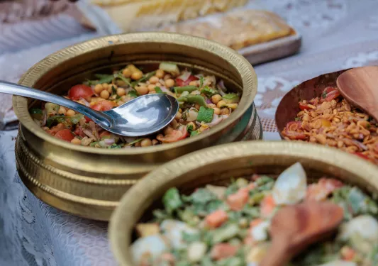 Copper bowls with cooked grains and vegetables
