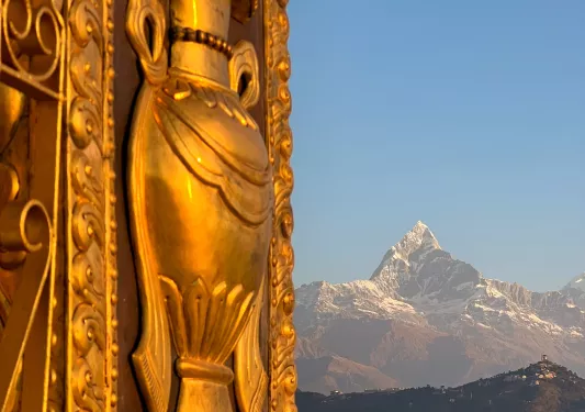 Large copper pillar with engraved sculptures