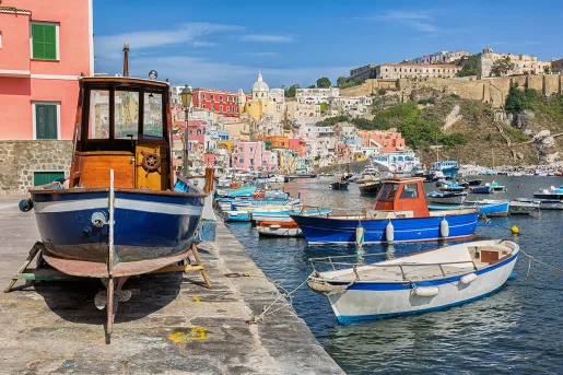 Pier on the Amalfi Coast, boast littering the water's edge.