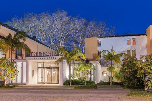 Exterior shot of Terra Nostra hotel at night.