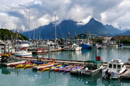 Boats sitting in a harbor atin Alaska