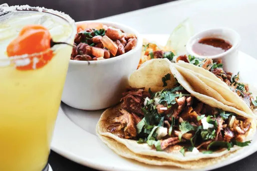Plate of mushroom tacos and a margarita.