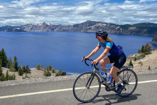 Guest cycling past Crater Lake.