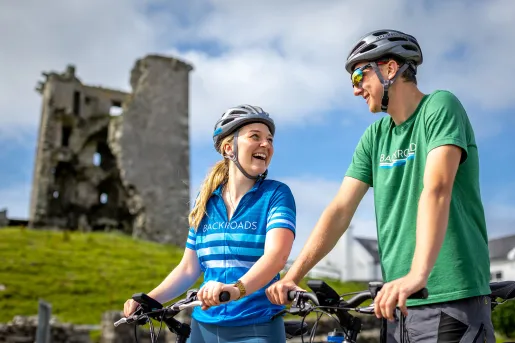 Cyclist In Front of Ruin Ireland