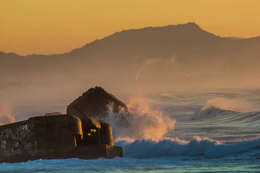 Water Crashing in Front of Mountains