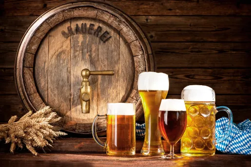 Mugs of beer in different types of glasses.