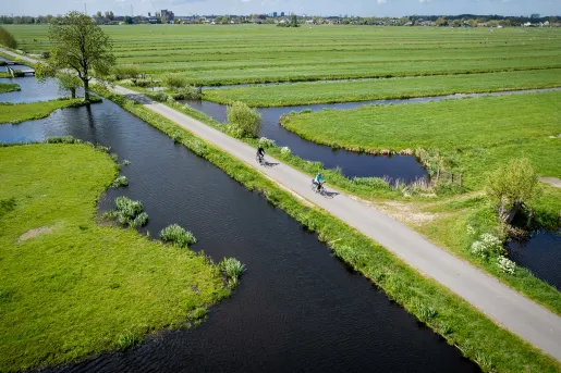 Ariel view of bikers in fields with ponds