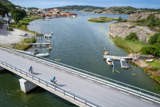 Two bikers riding over a bridge in Norway
