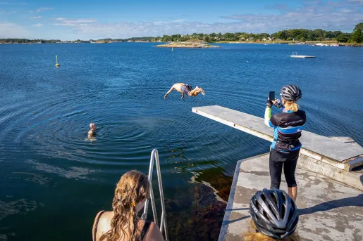 Guests diving into a river in Norway