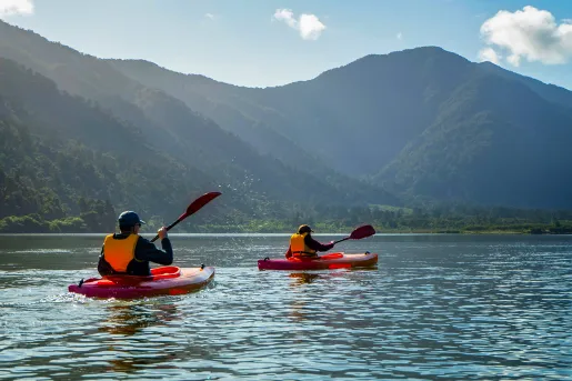Asia & Pacific Kayaking on River with Mountain View