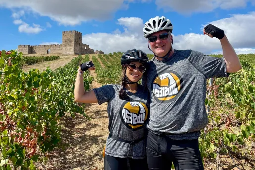 Two bikers posing in Vineyard.