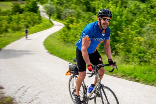 Biking along a winding road in Slovenia