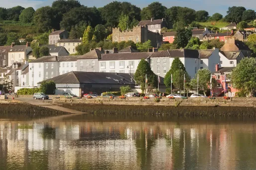Exterior view of the Actons Hotel from across the water.