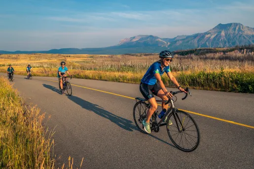 Backroads guests riding through golden fields