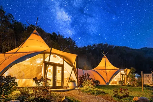 Shot of the Under Canvas camping village during nighttime. 