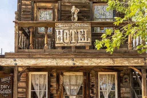 Storefront shot of the "MANE STREET HOTEL", old west style building.
