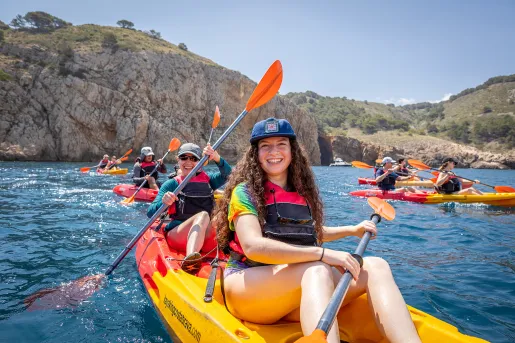 Group of happy young kayakers