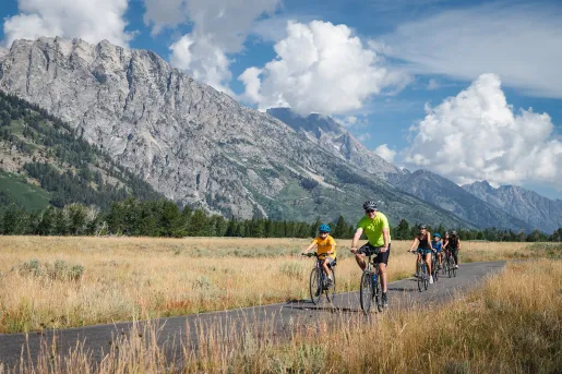 Backroads family smiling while biking 