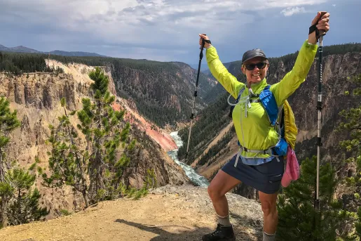 Backroads guest posing in front of a valley