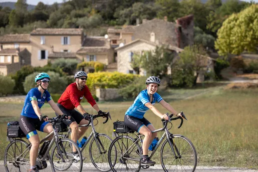 Three Backroads Guests Smiling and Biking
