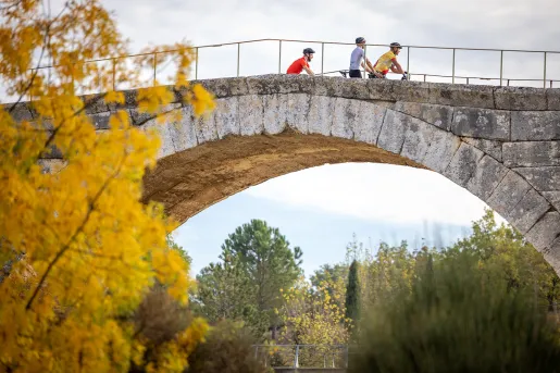 Backroads Guests Biking Over Bridge