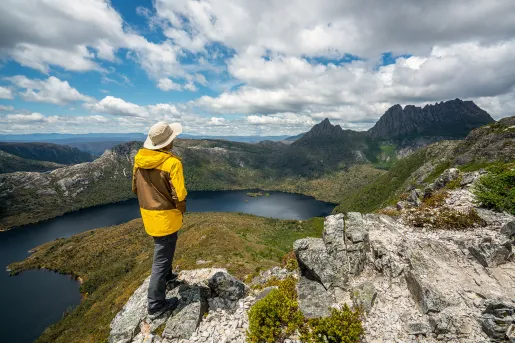 Hiker explores landscape of Marions lookout trail in Cradle Mountain National Park in Tasmania, Australia. 