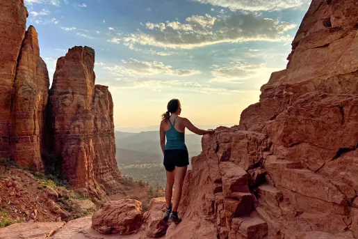 Guest on red-rock clifftop, overlooking Utah valley.