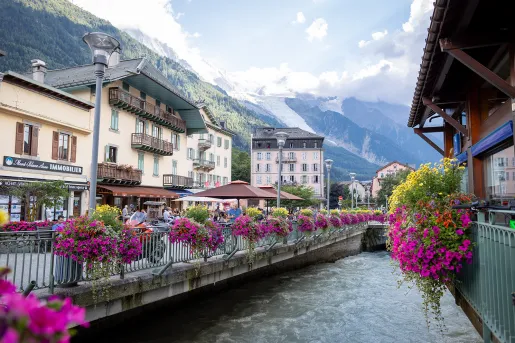 Shot of the Chamonix River, surrounded by storefronts.