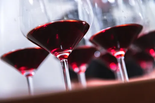 Close-up of red wine filled glasses.