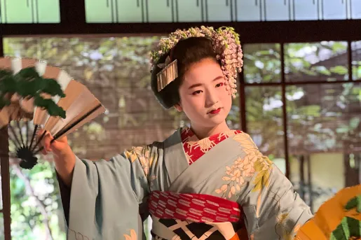 Japanese woman in a kimono performing