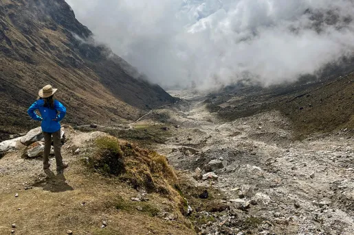Guest overlooking foggy mountain range.