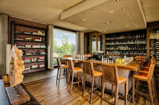 bar with shelves on wine bottles