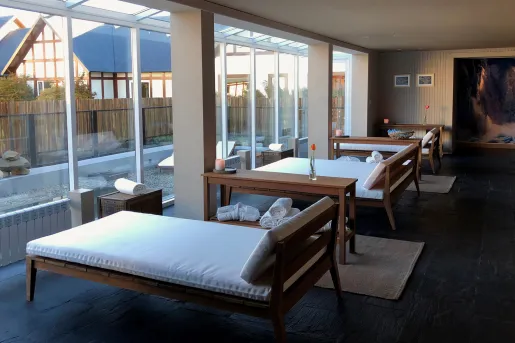 lounge chairs facing large windows